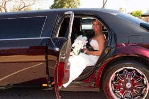 Limo Hire Perth Bride sitting in a Chrysler Limo on her wedding day