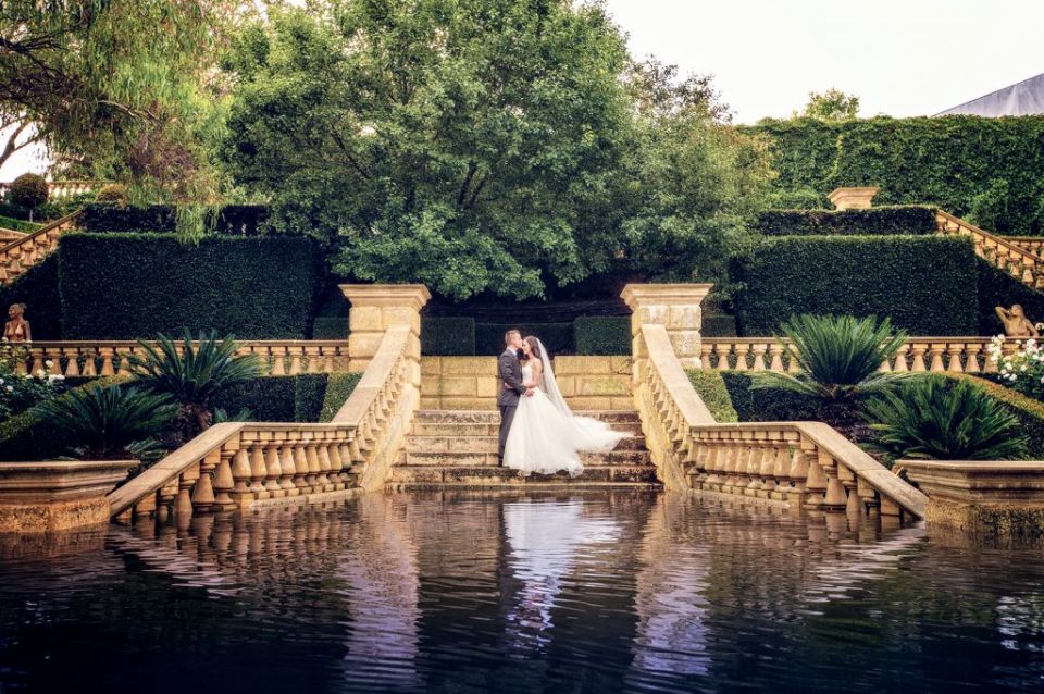 Ella Otranto Photography - Bride and Groom standing at flooded steps of Caversham House