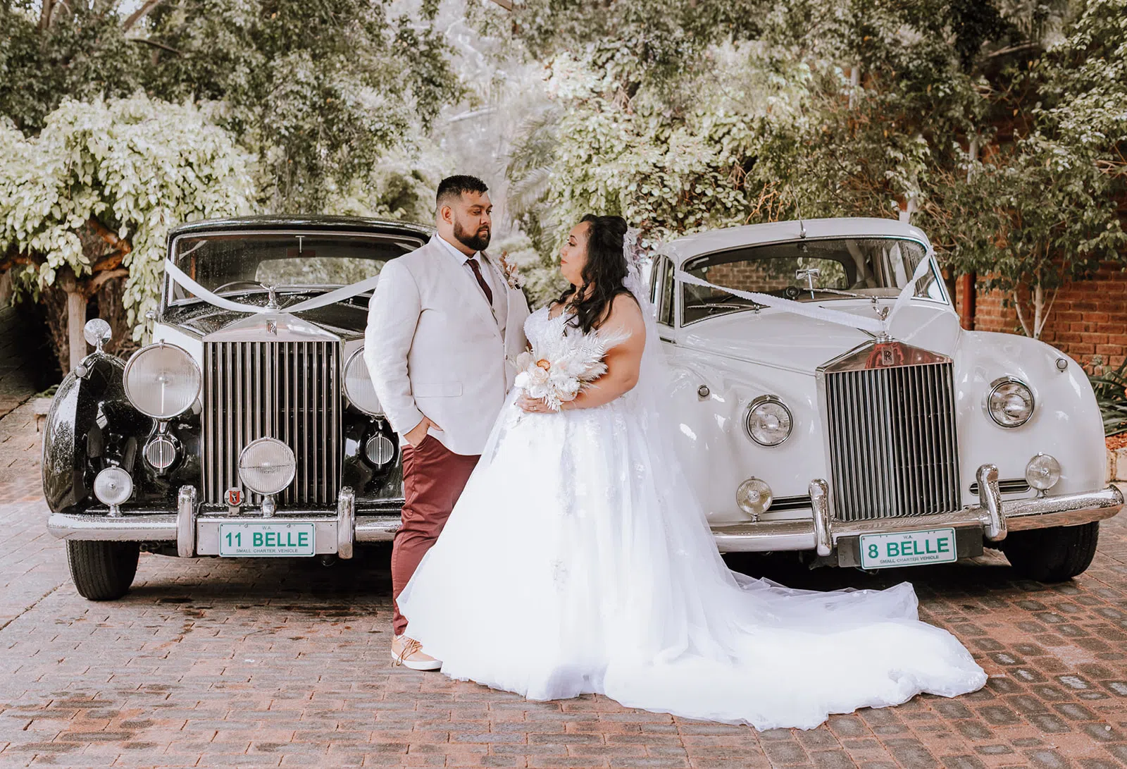 A wedding car with a giant door bow decoration