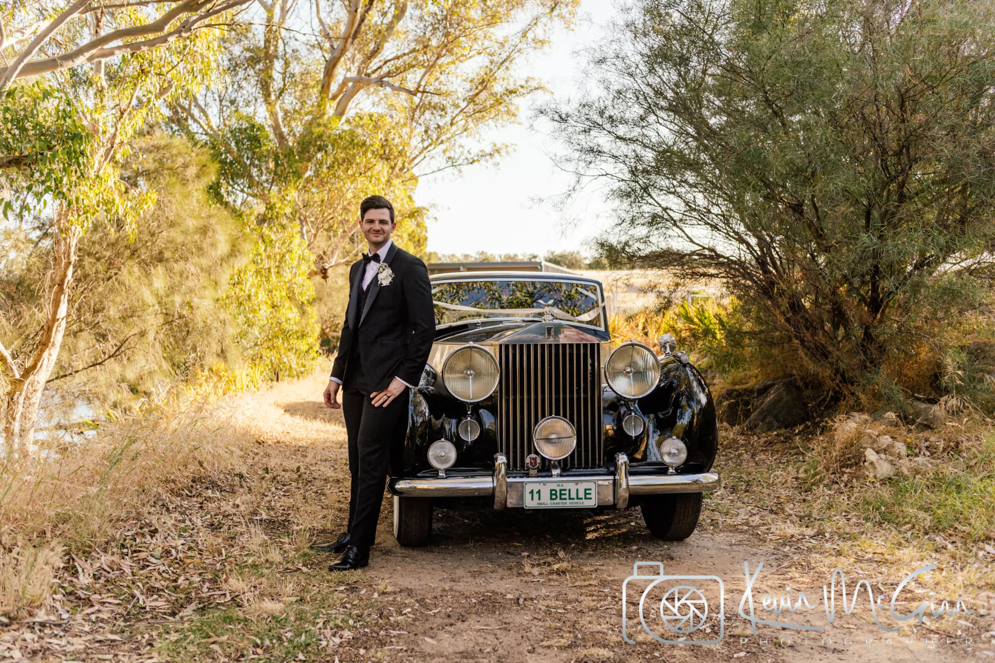 A wedding car with ribbon streamers on the windows