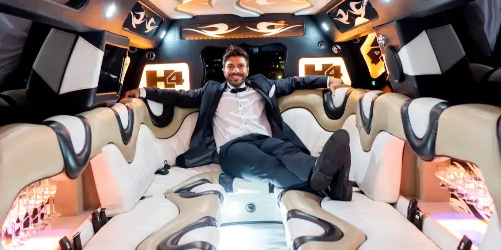 An image of a luxurious stretch limousine with a spacious interior, showcasing the comfortable seating arrangements for how many people can comfortably fit in a limo.