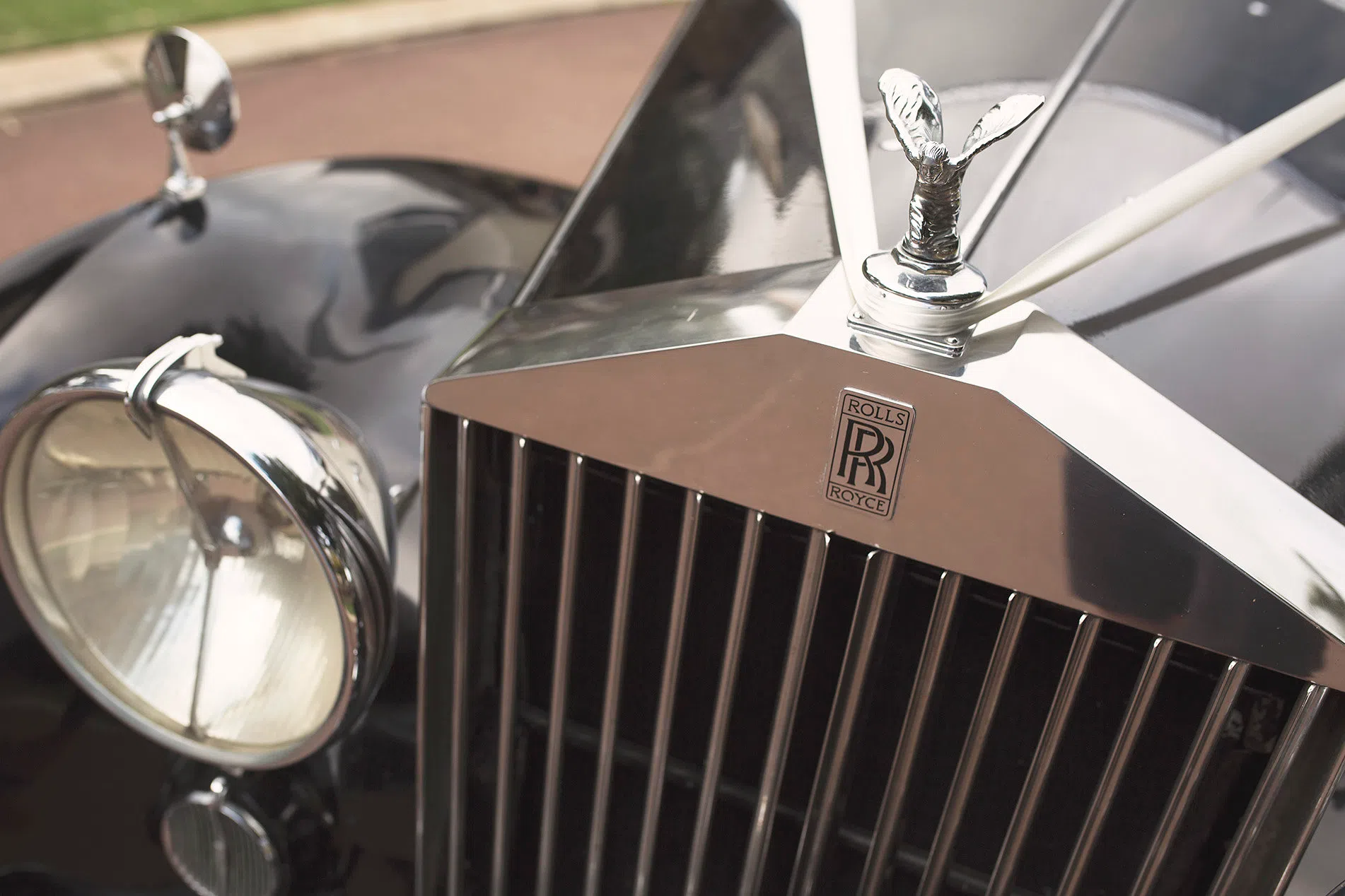 A wedding car with a decorated rear boot